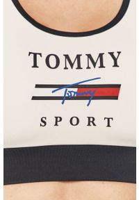 Tommy Sport - Biustonosz sportowy. Kolor: biały. Rodzaj stanika: odpinane ramiączka. Wzór: nadruk