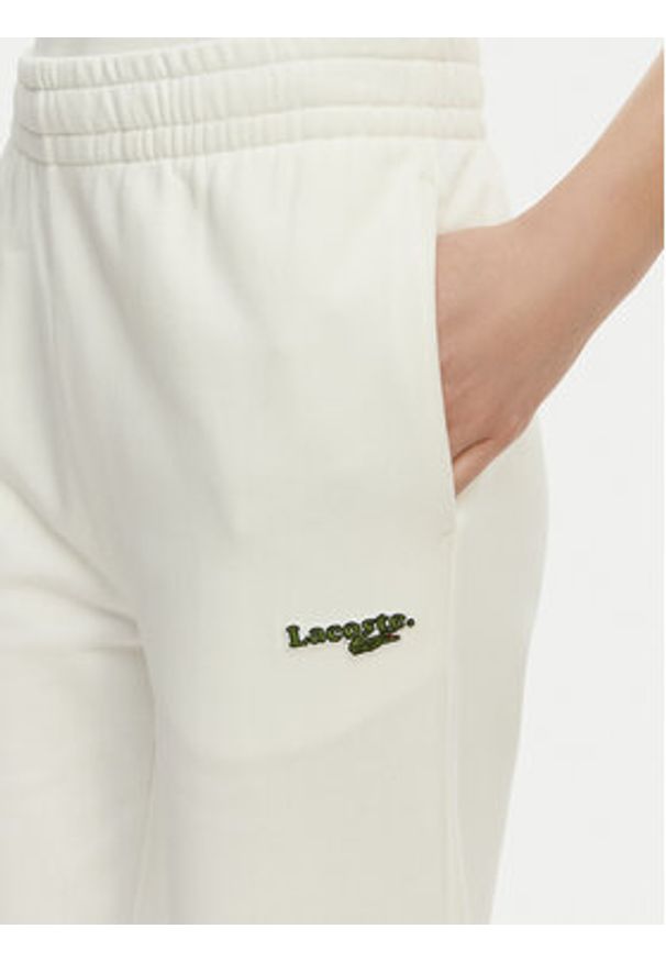 Lacoste Spodnie dresowe XF7604 Biały Regular Fit. Kolor: biały. Materiał: bawełna