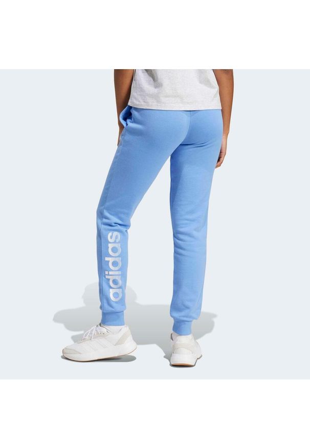 Adidas - Spodnie dresowe damskie ADIDAS Gym & Pilates. Kolor: niebieski. Materiał: dresówka. Sport: joga i pilates