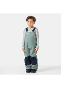 Dziecięce spodnie narciarskie na szelkach Helly Hansen Rider 2. Kolor: zielony. Sezon: zima. Sport: narciarstwo #1