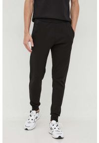 Calvin Klein spodnie dresowe kolor czarny gładkie. Kolor: czarny. Materiał: dresówka. Wzór: gładki #1