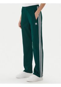 Adidas - adidas Spodnie dresowe Beckenbauer JV7395 Zielony Regular Fit. Kolor: zielony. Materiał: bawełna