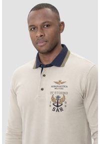 Aeronautica Militare - AERONAUTICA MILITARE Beżowy bawełniany męski longsleeve polo, Rozmiar 3XL. Okazja: na co dzień. Typ kołnierza: polo. Kolor: beżowy. Materiał: bawełna. Długość rękawa: długi rękaw. Wzór: aplikacja. Styl: sportowy, casual #1