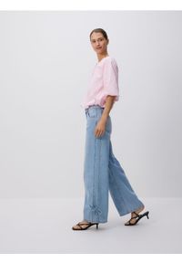 Reserved - Jeansy wide leg z kokardkami - niebieski. Kolor: niebieski