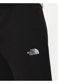 The North Face Spodnie dresowe Essential NF0A8A6J Czarny Relaxed Fit. Kolor: czarny. Materiał: bawełna #4