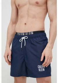 Calvin Klein szorty kąpielowe kolor granatowy. Kolor: niebieski. Materiał: tkanina, poliester, materiał. Wzór: nadruk #2