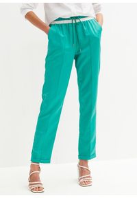 bonprix - Spodnie sportowe. Kolor: zielony. Styl: sportowy
