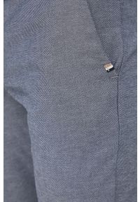 BOSS - Boss spodnie męskie kolor granatowy dopasowane. Kolor: niebieski