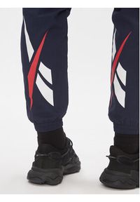 Reebok Spodnie dresowe Classics Vector Tracksuit Bottoms H54439 Niebieski Slim Fit. Kolor: niebieski. Materiał: syntetyk