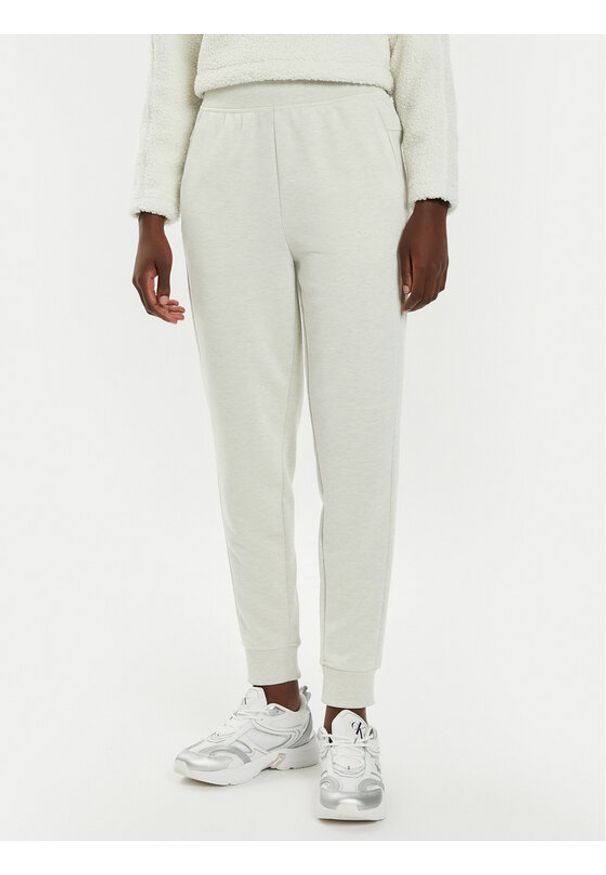 Calvin Klein Performance Spodnie dresowe 00GWS4P651 Beżowy Relaxed Fit. Kolor: beżowy. Materiał: syntetyk