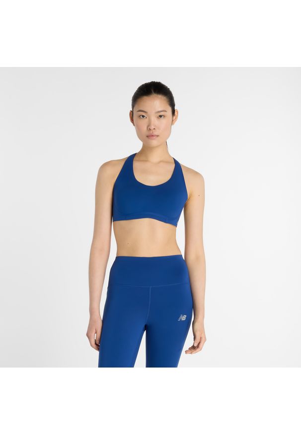 Biustonosz do biegania New Balance WB51052GAB – niebieski. Kolor: niebieski. Materiał: poliester, tkanina, lycra, materiał, skóra. Wzór: gładki