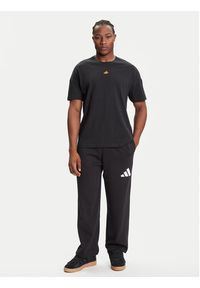 Adidas - adidas Spodnie dresowe Essentials JF3567 Czarny Loose Fit. Kolor: czarny. Materiał: syntetyk, bawełna