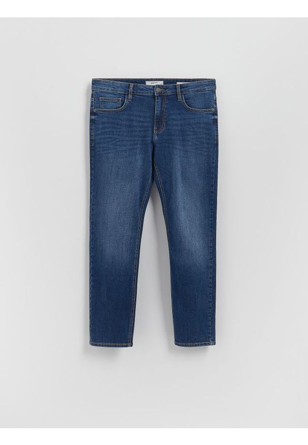 Reserved - Jeansy slim z efektem sprania - granatowy. Kolor: niebieski