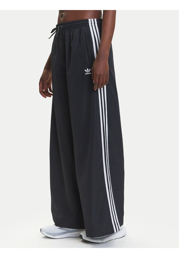Adidas - adidas Spodnie dresowe adicolor Firebird JD3390 Czarny Loose Fit. Kolor: czarny. Materiał: syntetyk