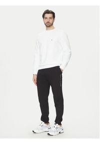 TOMMY HILFIGER - Tommy Hilfiger Spodnie dresowe UM0UM03348 Czarny Regular Fit. Kolor: czarny. Materiał: bawełna