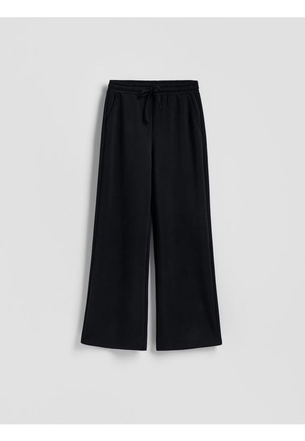 Reserved - Spodnie z szeroką nogawką - czarny. Kolor: czarny. Materiał: dzianina