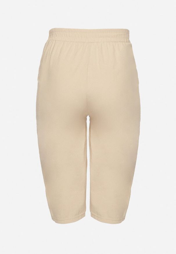 Born2be - Beżowe Luźne Spodnie z Bawełny z Wysokim Stanem 3/4 Lumelle. Okazja: na co dzień. Stan: podwyższony. Kolor: beżowy. Materiał: bawełna. Styl: klasyczny, casual