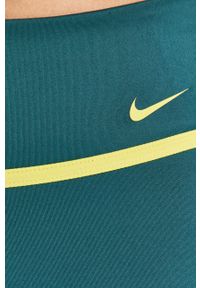 Nike - Legginsy. Kolor: zielony. Materiał: tkanina, włókno, dzianina, skóra. Technologia: Dri-Fit (Nike). Wzór: nadruk #2