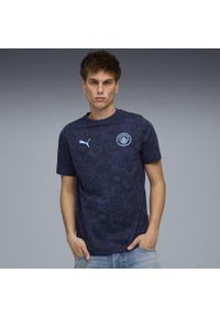 Puma - Męska koszulka Manchester City FtblCulture z nadrukiem na całej powierzchni PUMA. Kolor: niebieski. Wzór: nadruk