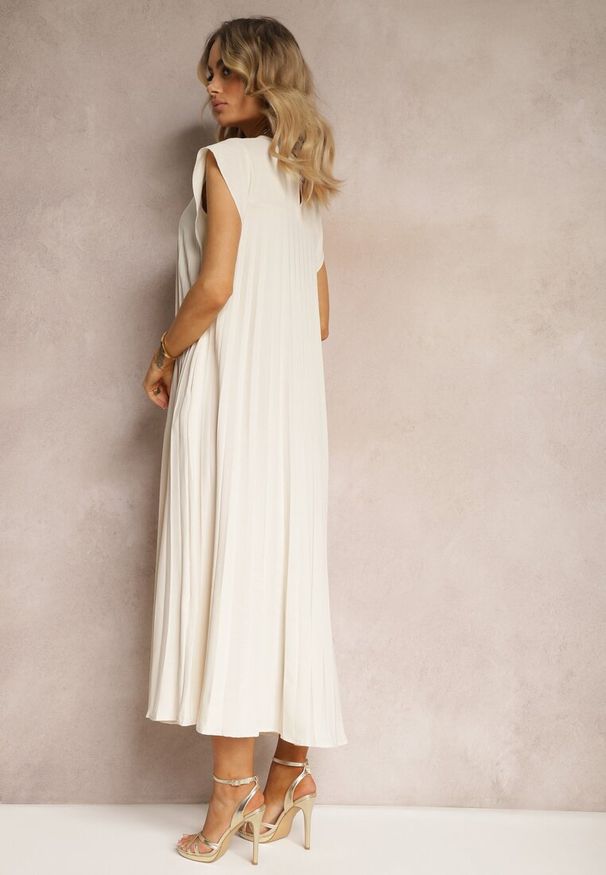 Renee - Beżowa Rozkloszowana Sukienka z Plisowaniem i Krótkim Rękawem Hevina. Okazja: do pracy, na co dzień, na spotkanie biznesowe. Kolor: beżowy. Długość rękawa: krótki rękaw. Typ sukienki: rozkloszowane. Styl: casual, biznesowy