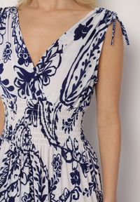 Born2be - Niebieska Sukienka z Roślinnym Wzorem i Kopertowym Dekoltem z Gumką w Talii Orrune. Okazja: do pracy, na co dzień, na spotkanie biznesowe. Typ kołnierza: dekolt kopertowy. Kolor: niebieski. Materiał: jeans. Sezon: lato. Typ sukienki: kopertowe. Styl: casual, klasyczny, biznesowy #7