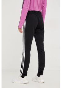 Adidas - adidas spodnie dresowe damskie kolor czarny z aplikacją. Kolor: czarny. Materiał: dresówka. Wzór: aplikacja #2