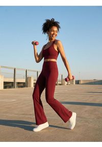 Sinsay - Spodnie flare Gym Hard - bordowy. Kolor: czerwony #1