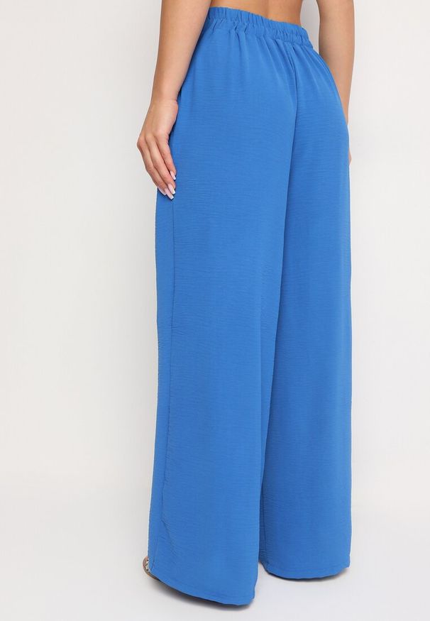 Born2be - Niebieskie Szerokie Spodnie Alladynki z Wysokim Stanem i Gumką w Talii Rissanas. Stan: podwyższony. Kolor: niebieski. Materiał: jedwab. Wzór: aplikacja