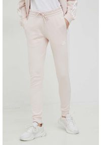 Adidas - adidas spodnie dresowe kolor różowy z aplikacją. Kolor: różowy. Materiał: dresówka. Wzór: aplikacja #1