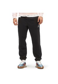 Spodnie New Balance UP21500BK - czarne. Kolor: czarny. Materiał: dresówka, materiał. Sport: fitness