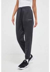 Calvin Klein Performance spodnie treningowe kolor szary melanżowe. Stan: podwyższony. Kolor: szary. Wzór: melanż