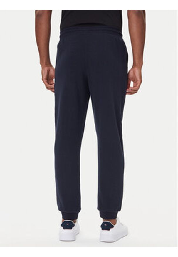 TOMMY HILFIGER - Tommy Hilfiger Spodnie dresowe UM0UM03664 Granatowy Regular Fit. Kolor: niebieski. Materiał: bawełna