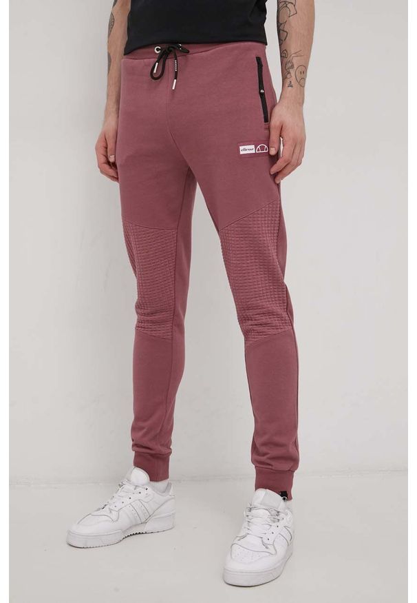 Ellesse Spodnie męskie kolor różowy gładkie. Kolor: różowy. Materiał: dzianina. Wzór: gładki