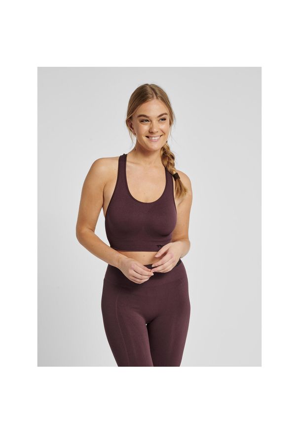 Damski bezszwowy biustonosz sportowy Hummel Tif. Kolor: czerwony, wielokolorowy, brązowy, różowy. Sport: fitness