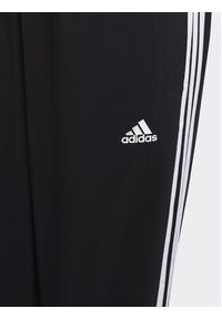 Adidas - adidas Spodnie dresowe Essentials 3-Stripes Woven Tracksuit Bottoms HR6334 Czarny Slim Fit. Kolor: czarny. Materiał: syntetyk