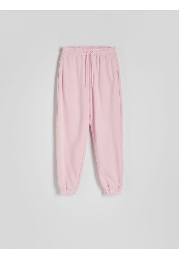 Reserved - Spodnie dresowe z efektem acid wash - pastelowy róż. Kolor: różowy. Materiał: dresówka