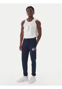 Tommy Jeans Spodnie dresowe DM0DM22094 Granatowy Relaxed Fit. Kolor: niebieski. Materiał: bawełna #3