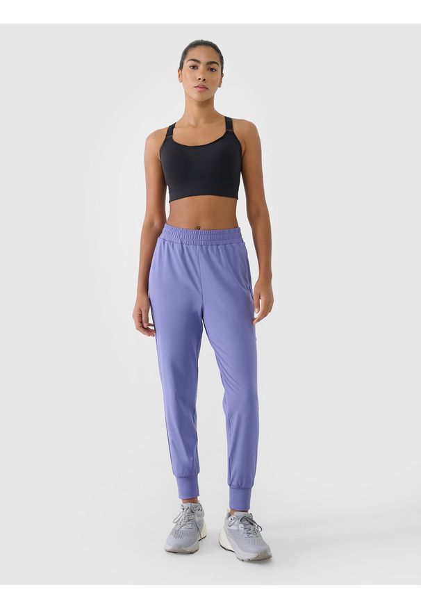 4f - 4F Spodnie treningowe szybkoschnące damskie - granatowe XXL. Kolor: niebieski. Materiał: syntetyk, włókno, dzianina, materiał, elastan. Wzór: jednolity, ze splotem. Sport: fitness