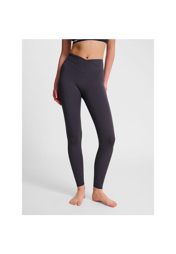 Damskie legginsy z wysokim stanem Hummel Wrap. Stan: podwyższony. Kolor: szary, wielokolorowy, brązowy, czarny. Sport: fitness, joga i pilates