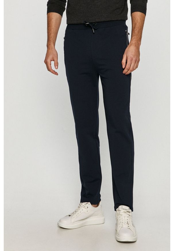 Karl Lagerfeld - Spodnie. Kolor: niebieski. Materiał: bawełna, dzianina, elastan. Wzór: nadruk