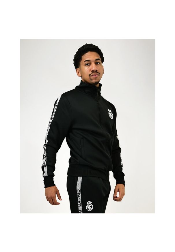 Dres treningowy Real Madrid męski 25/26 - czarny. Kolor: czarny, wielokolorowy. Materiał: dresówka. Sport: piłka nożna, fitness
