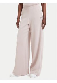 Guess Spodnie dresowe V4YB07 KCAY2 Różowy jasny Relaxed Fit. Kolor: różowy. Materiał: syntetyk #1