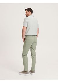 Reserved - Bawełniane spodnie slim fit - jasnoturkusowy. Kolor: turkusowy. Materiał: bawełna #1