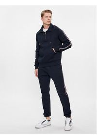 TOMMY HILFIGER - Tommy Hilfiger Spodnie dresowe Global Stripe MW0MW33660 Granatowy Regular Fit. Kolor: niebieski. Materiał: bawełna, syntetyk