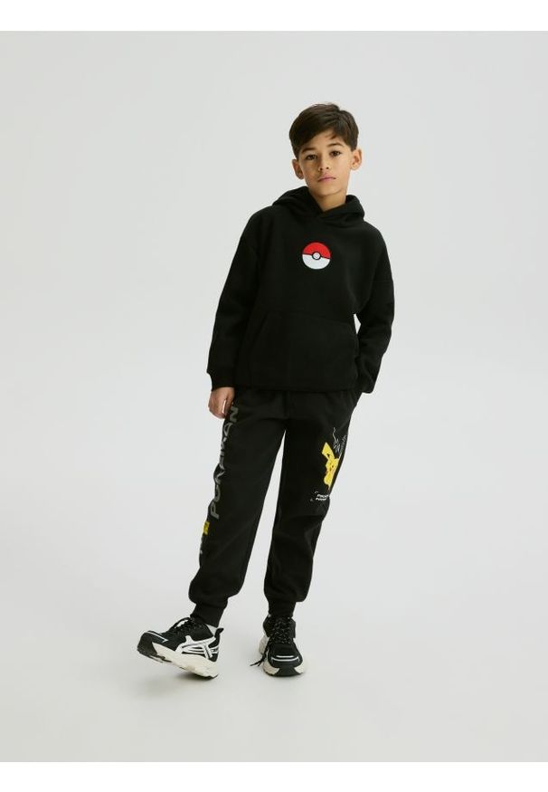 Reserved - Dresowe spodnie Pokémon - czarny. Kolor: czarny. Materiał: dresówka