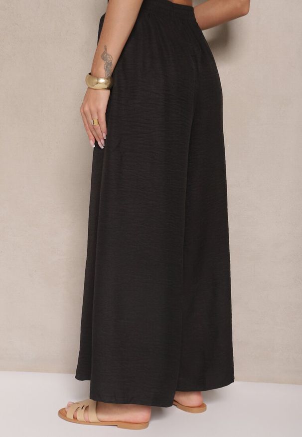 Renee - Czarne Szerokie Spodnie High Waist Ozdobione Wiązaniem Telonia. Okazja: na co dzień. Stan: podwyższony. Kolor: czarny. Wzór: aplikacja. Styl: casual, elegancki