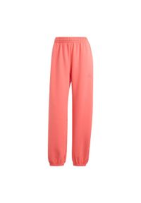 Adidas - Spodnie ALL SZN Soft Lux Loose. Kolor: żółty, pomarańczowy, wielokolorowy