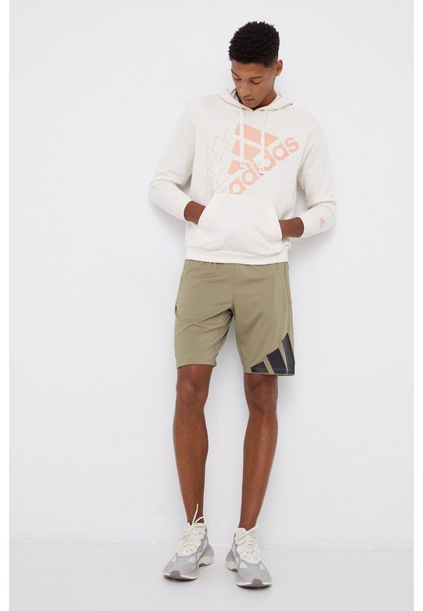 Adidas - adidas Bluza kolor beżowy z kapturem z nadrukiem. Okazja: na co dzień. Typ kołnierza: kaptur. Kolor: beżowy. Materiał: bawełna. Wzór: nadruk. Styl: casual