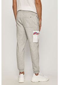 Tommy Jeans - Spodnie. Kolor: szary. Materiał: bawełna, poliester, dzianina. Wzór: aplikacja #2