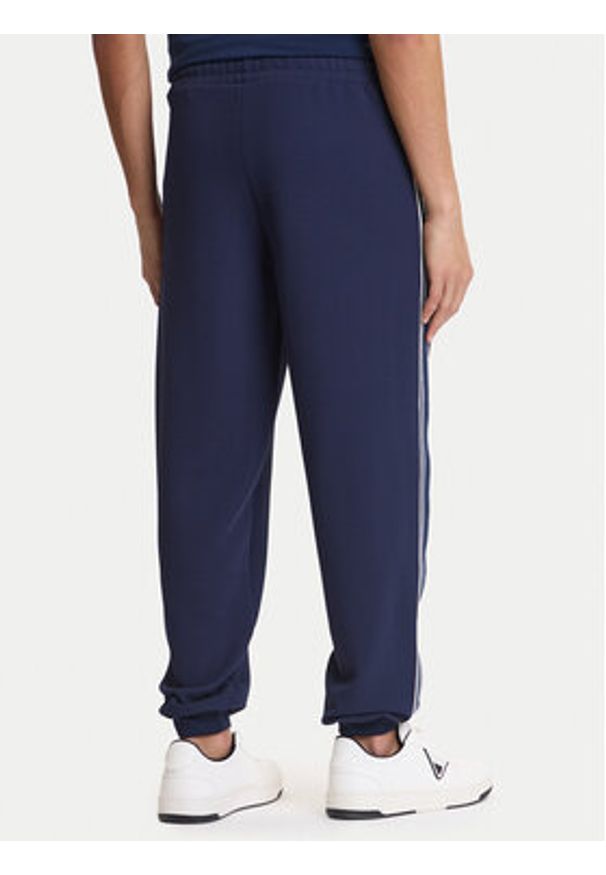 Guess Spodnie dresowe Z6GB11 K3202 Granatowy Regular Fit. Kolor: niebieski. Materiał: syntetyk